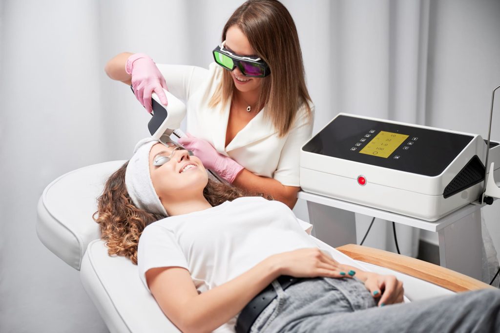 young woman receiving laser facial treatment in co 2022 06 20 05 30 15 utc